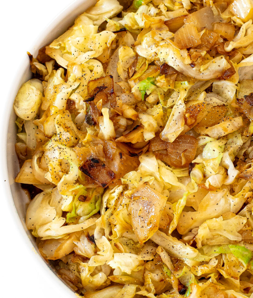 Sauteed cabbage served in a white bowl. 