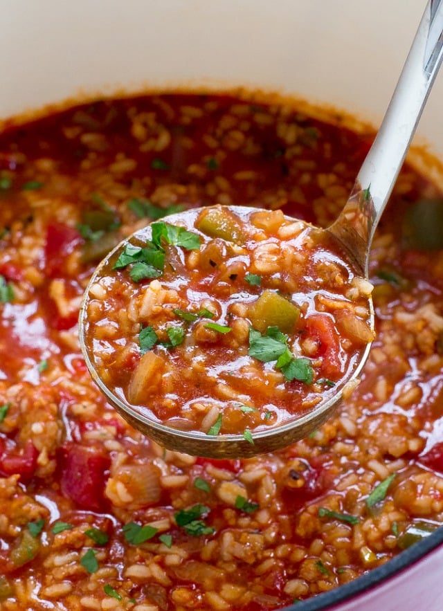 Sausage Rice and Pepper Soup topped with fresh chopped parsley.