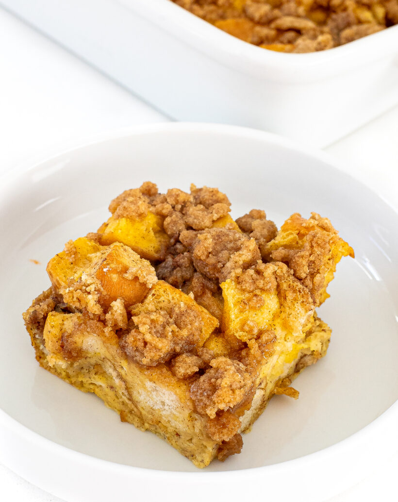 A piece of eggnog casserole on a white plate.