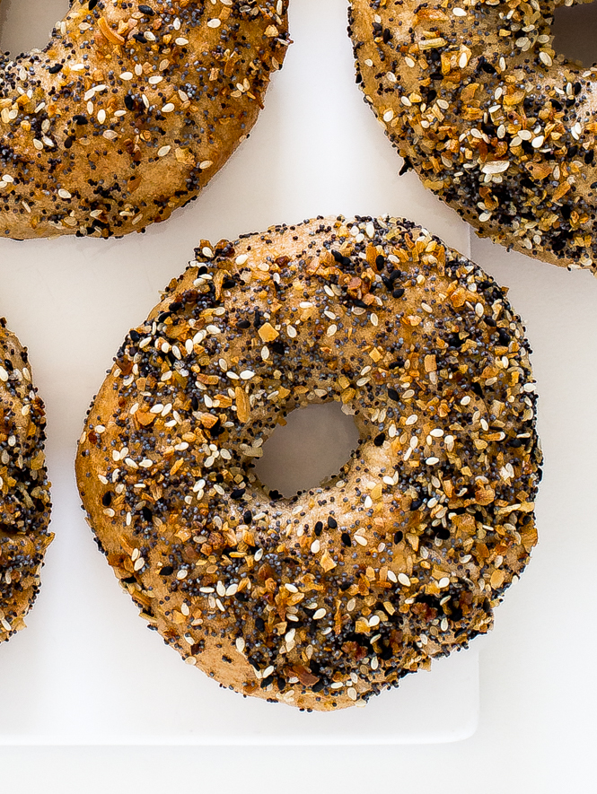 Homemade Bagels | chefsavvy.com Homemade Everything Bagels on a white board.