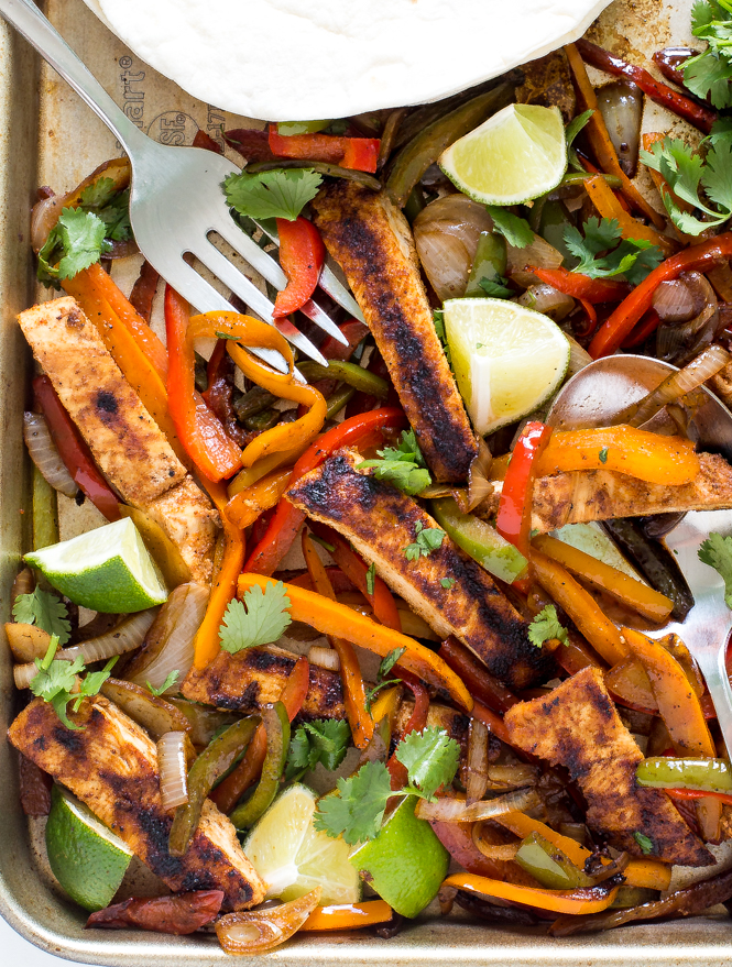 chicken fajitas and peppers on sheet pan