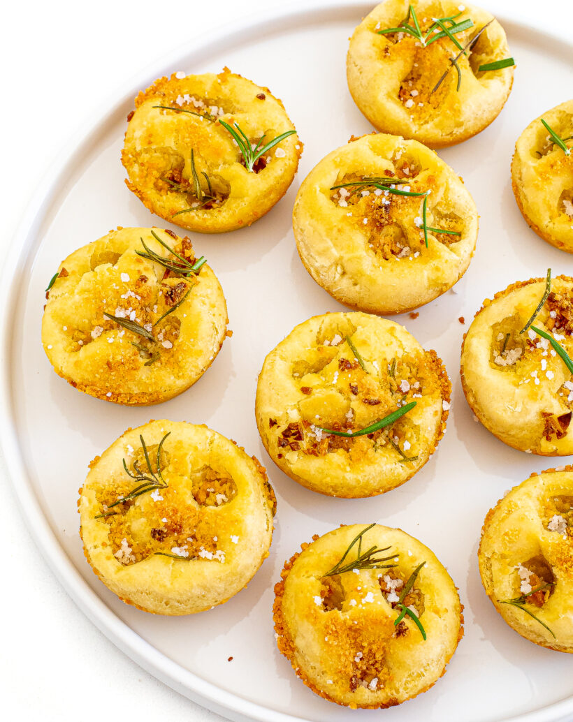 Focaccia muffins served on a white plate. 