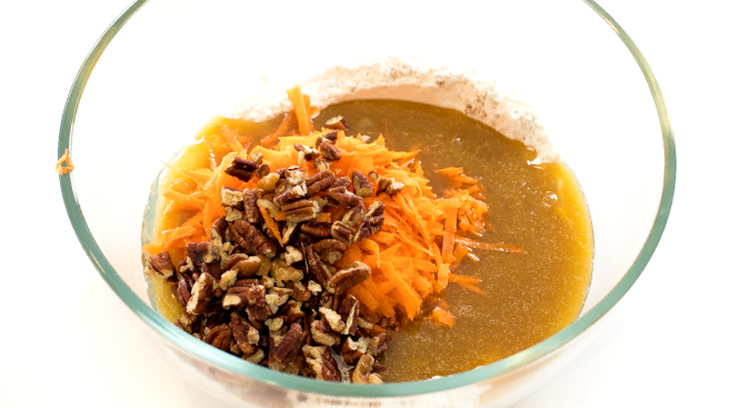 add walnuts and carrot to other ingredients in mixing bowl