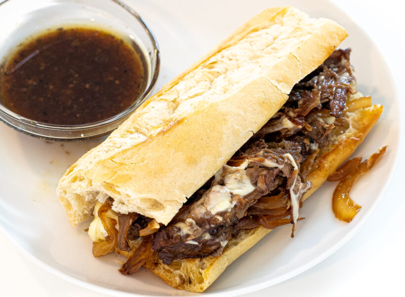 slow cooker French dip sandwich on white plate