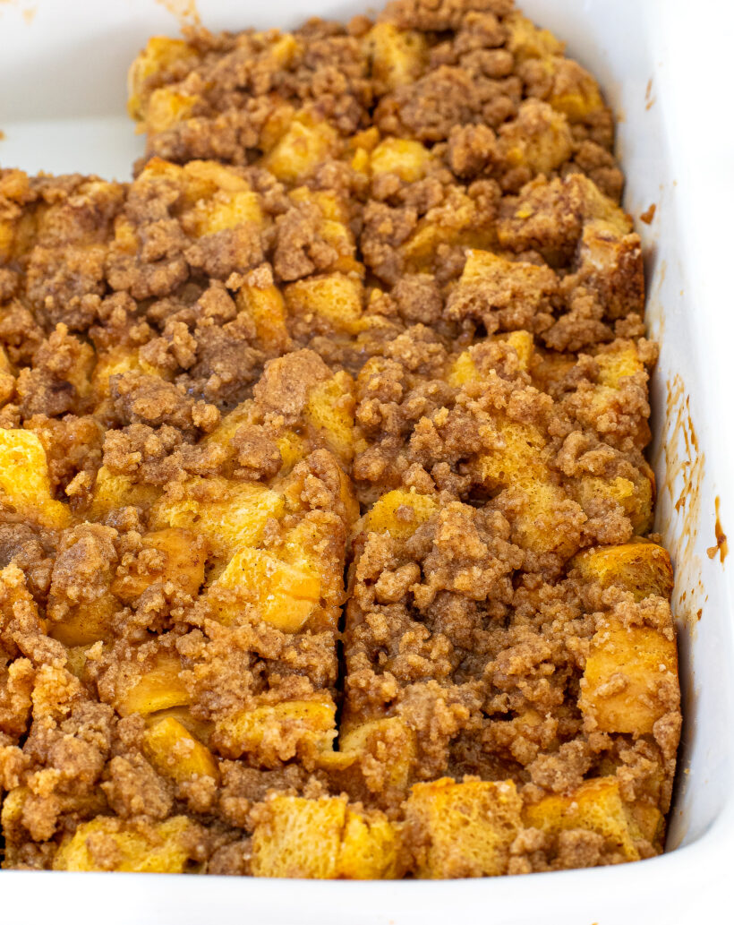 Eggnog casserole in a white baking pan.
