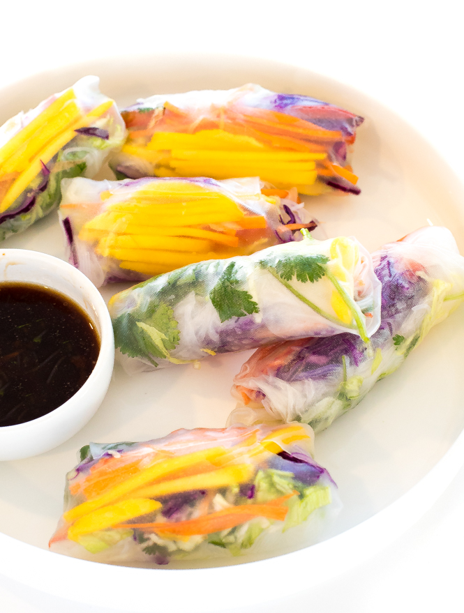 Rainbow Vegetable Spring Rolls on a white plate with dipping sauce