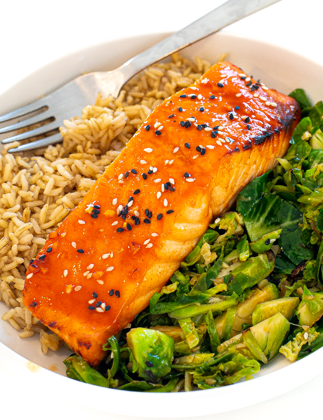 Bowl with rice, Gochujang Glazed Salmon and broccoli and a silver fork. 