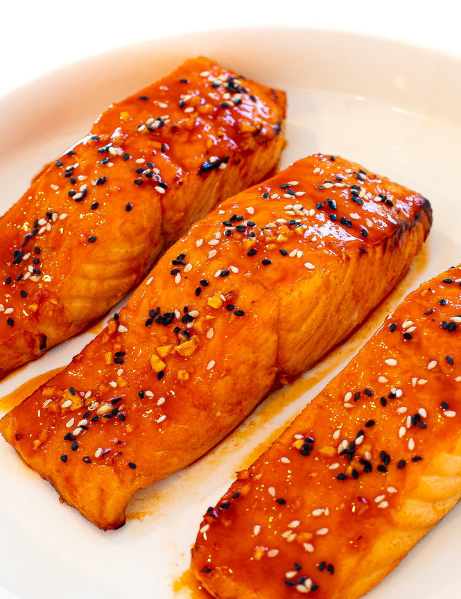 Up close shot of Gochujang Glazed Salmon in a white bowl. 
