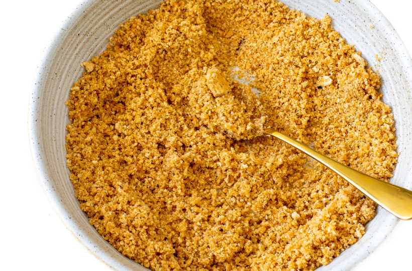 Graham cracker crust ingredients in a mixing bowl.