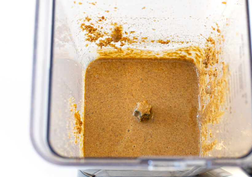 Granola butter in a blender after being blended. 