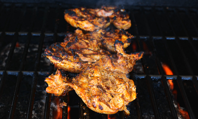 grilling chicken thighs on hot grill