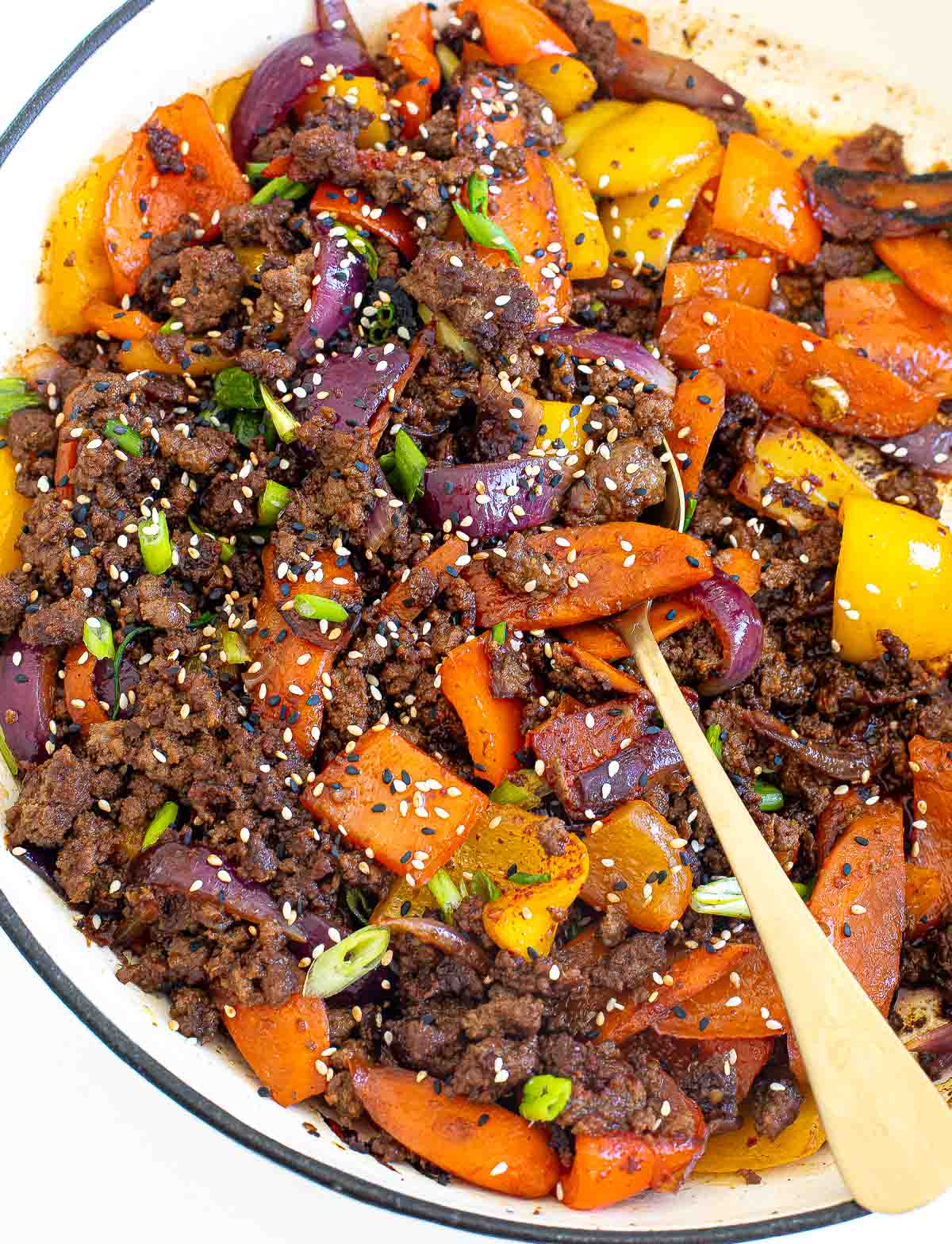 ground beef stir fry with sesame seeds on top