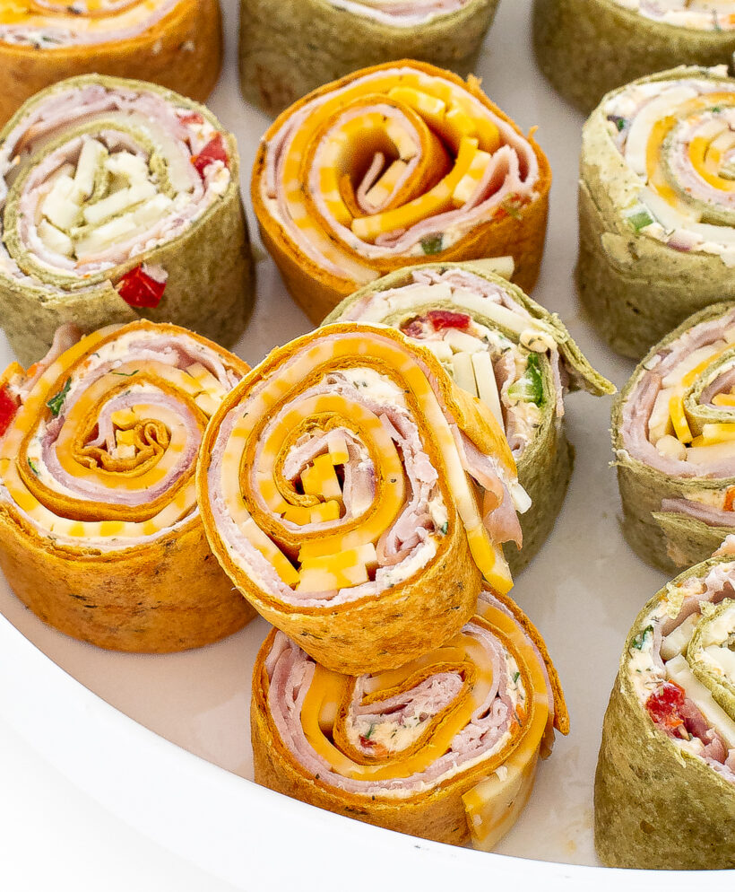 Ham and cheese pinwheels stacked on top of each other.