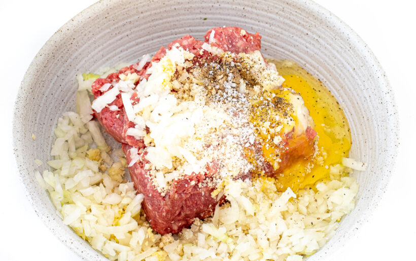 Ingredients for slow cooker hawaiian meatballs in a mixing bowl.