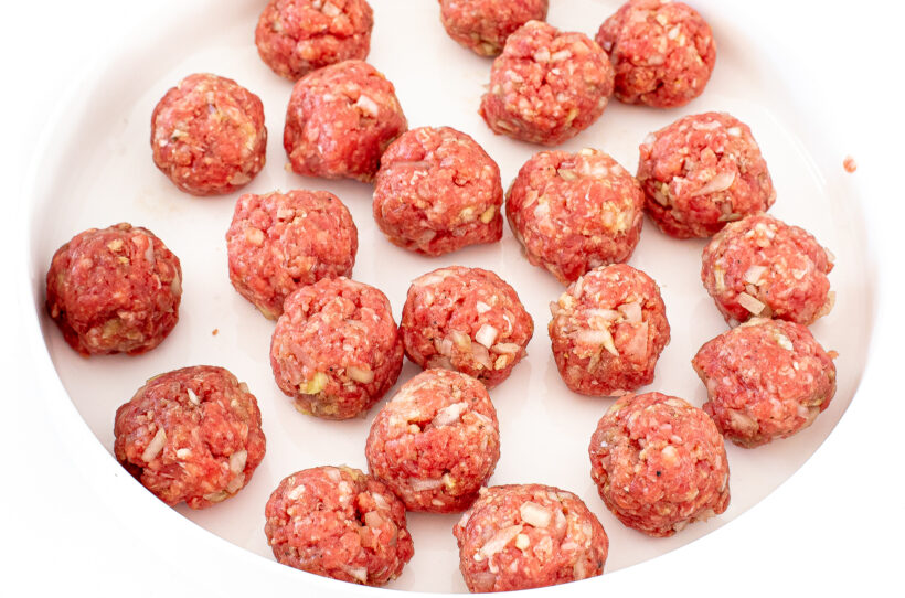 Uncooked Slow Cooker Hawaiian Meatballs on a plate.