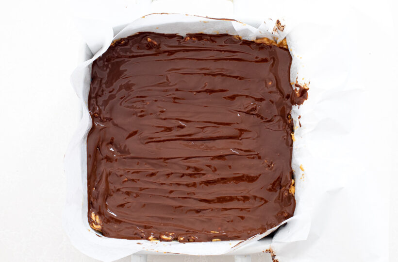 Scotcheroos with a chocolate layer on top before freezing. 