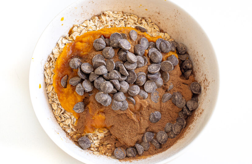 Ingredients for pumpkin cookies in a bowl.
