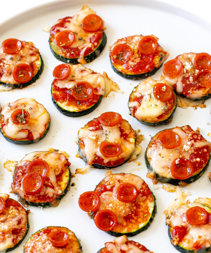 Pizza bites served on a plate.