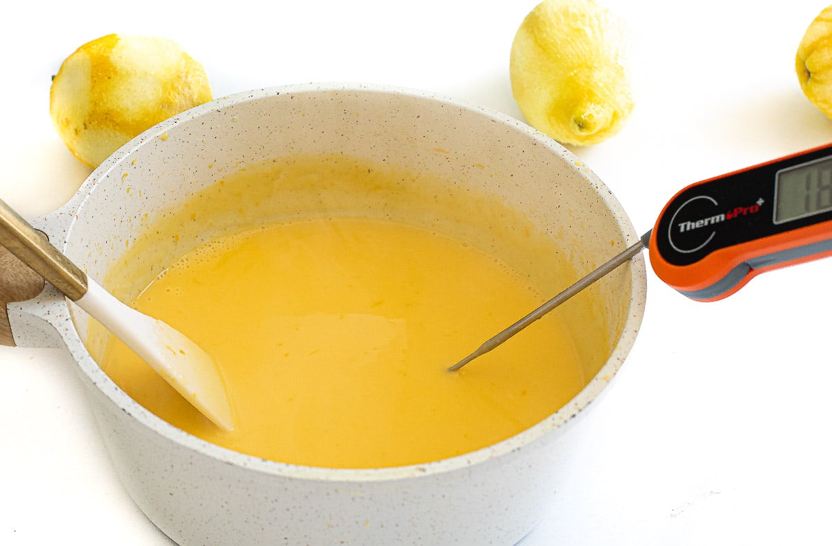cooking egg custard mixture in a small saucepan