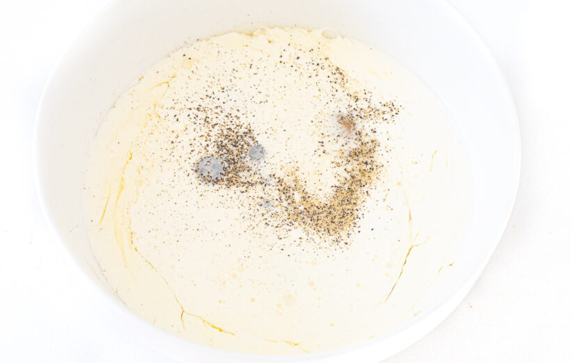 Eggs and cream in a mixing bowl.