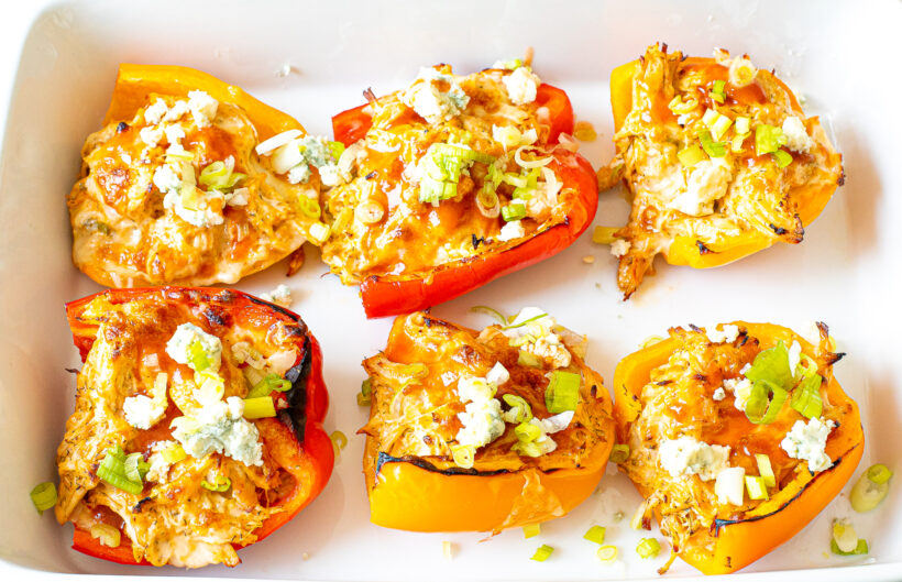 Stuffed peppers topped with buffalo sauce, blue cheese, and green onions.