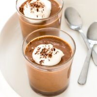 This 3-ingredient homemade chocolate mousse in two glasses topped with whipped cream and chocolate shavings | chefsavvy.com