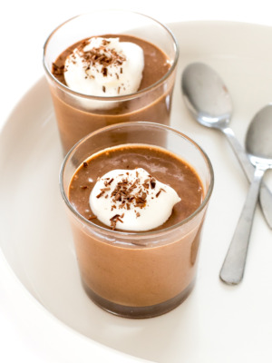 This 3-ingredient homemade chocolate mousse in two glasses topped with whipped cream and chocolate shavings | chefsavvy.com