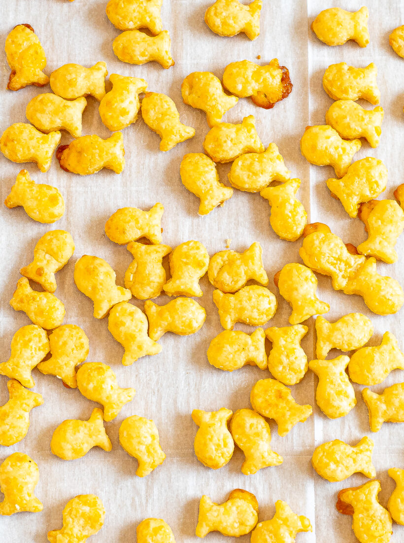 Crispy goldfish crackers on a sheet pan. 