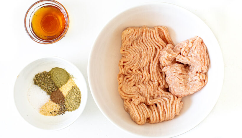 Ingredients for chicken breakfast sausages laid out.