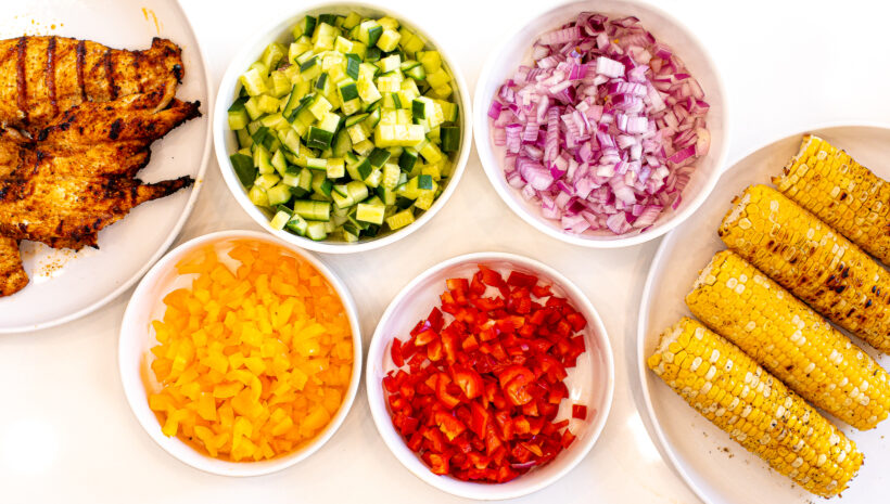 Ingredients laid out for chopped chicken salad.