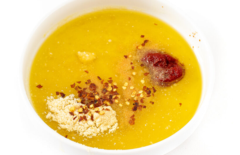 Dipping oil ingredients in a white bowl.