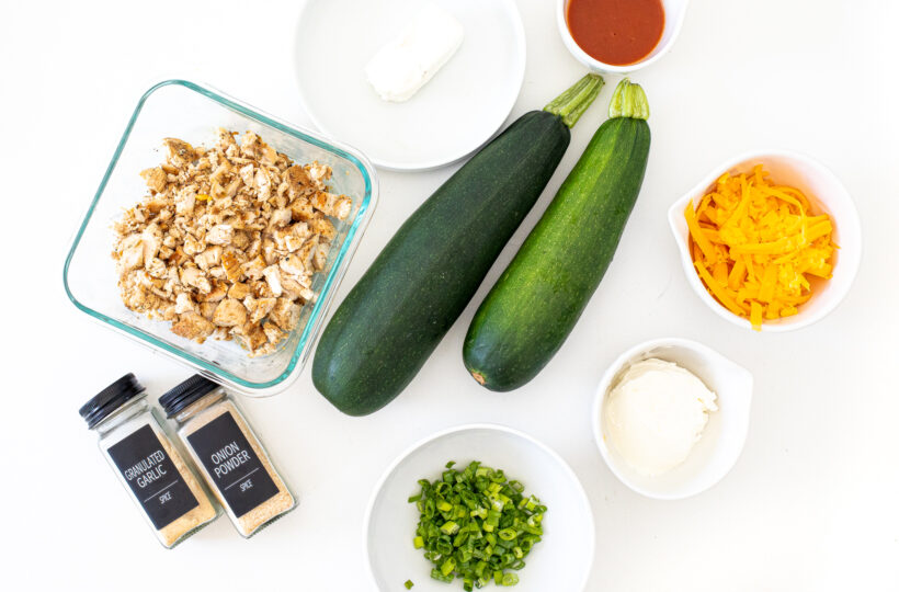 Ingredients needed for buffalo chicken zucchini boats.