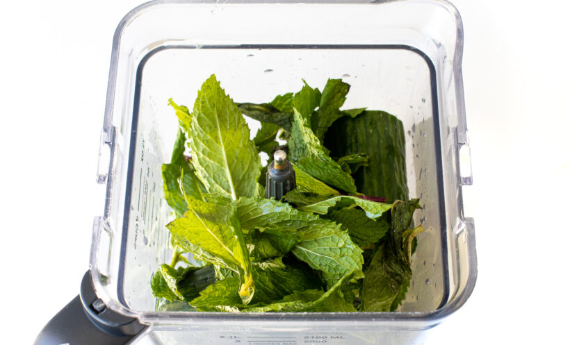 Overhead shot of mint cucumber lemonade ingredients in a blender.