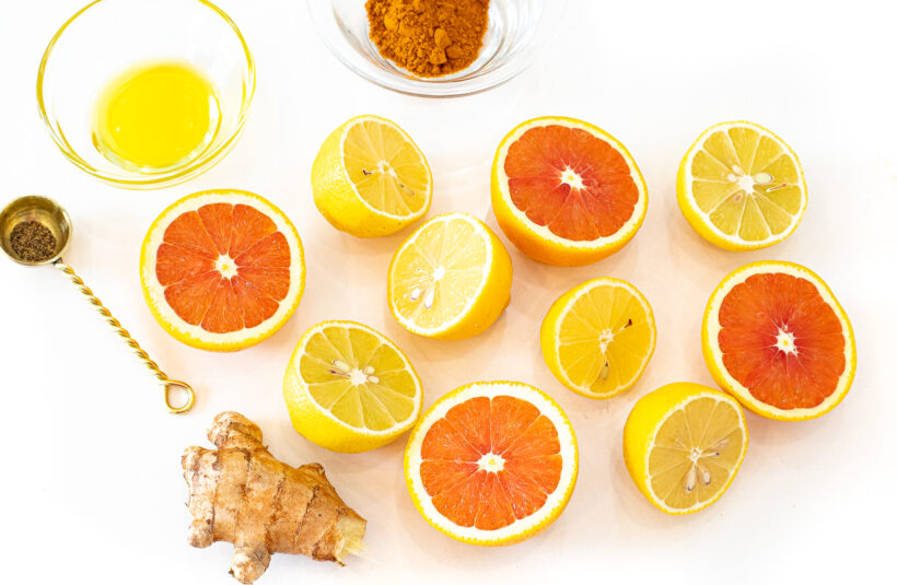 Overhead shot of ingredients needed for wellness glow shots. 