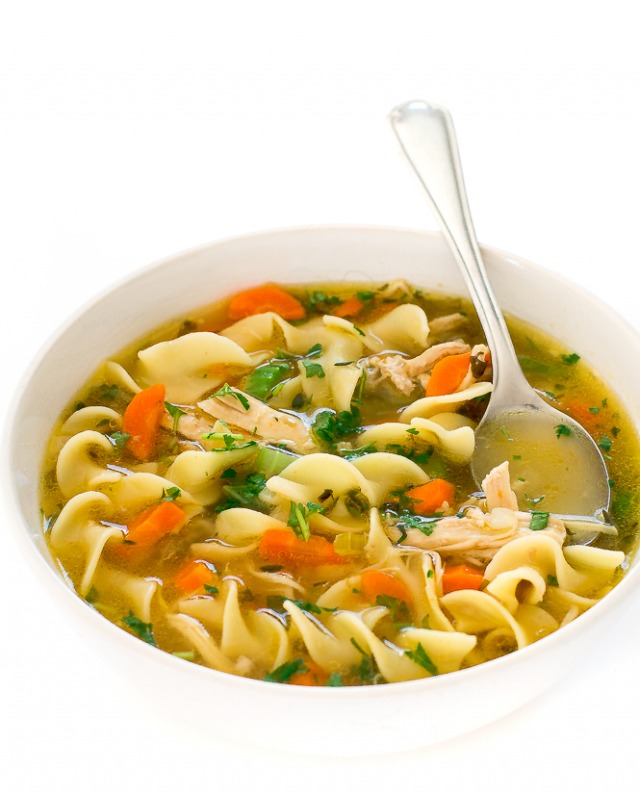 Bowl of instant pot chicken noodle soup with a spoon. 
