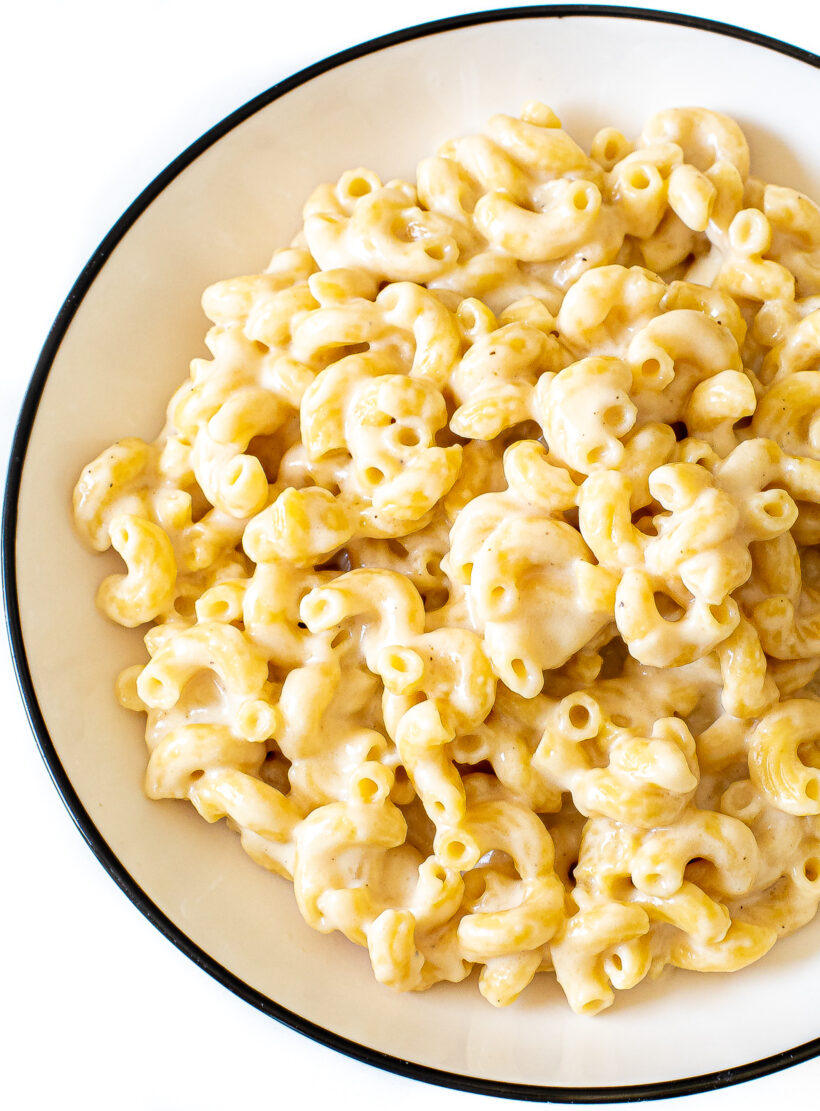 A serving of instant pot mac and cheese on a white plate.