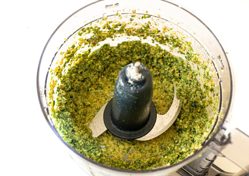 Kale pesto in the food processor after being blended.