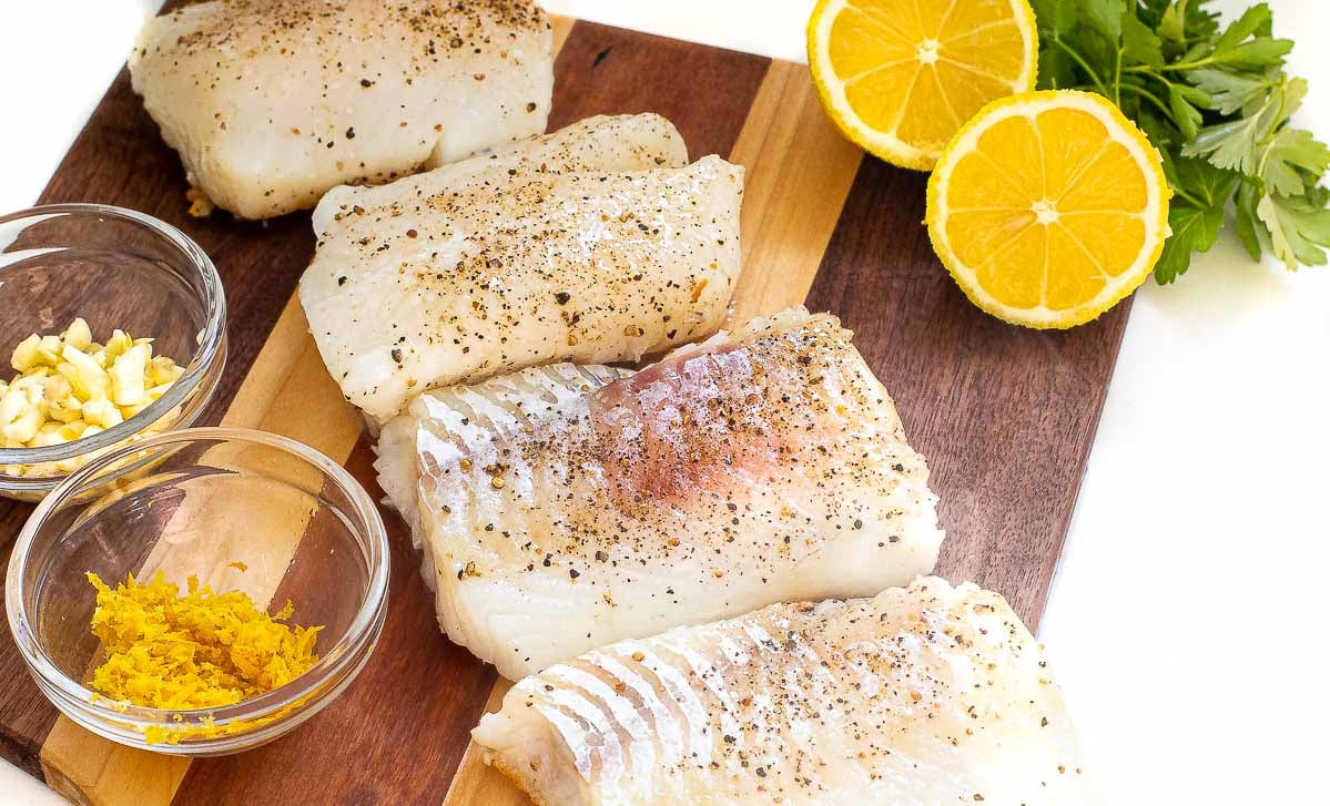 ingredients for lemon code on wooden cutting board 