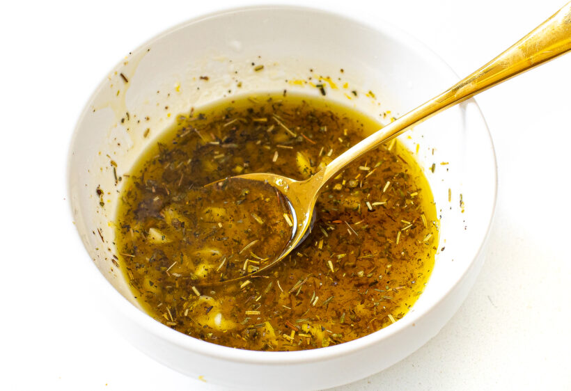 Lemon vinaigrette in a small mixing bowl. 
