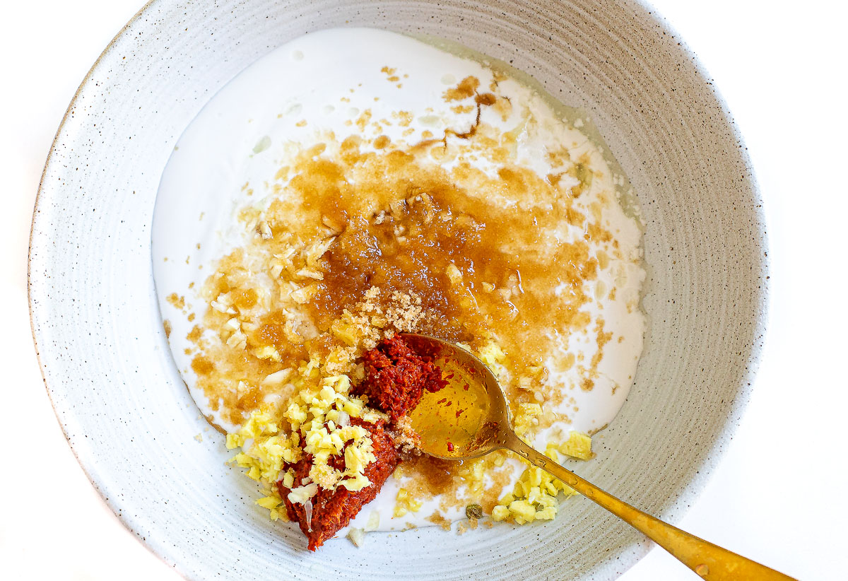 mixing marinade ingredients for thai chicken satay