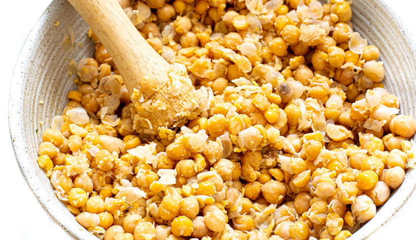 Chickpeas mashed with a wooden spoon.