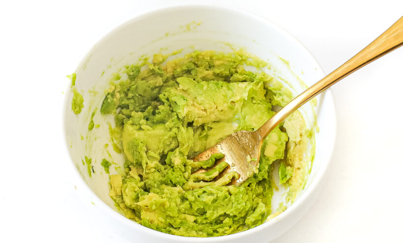 Smashed avocado in a bowl.