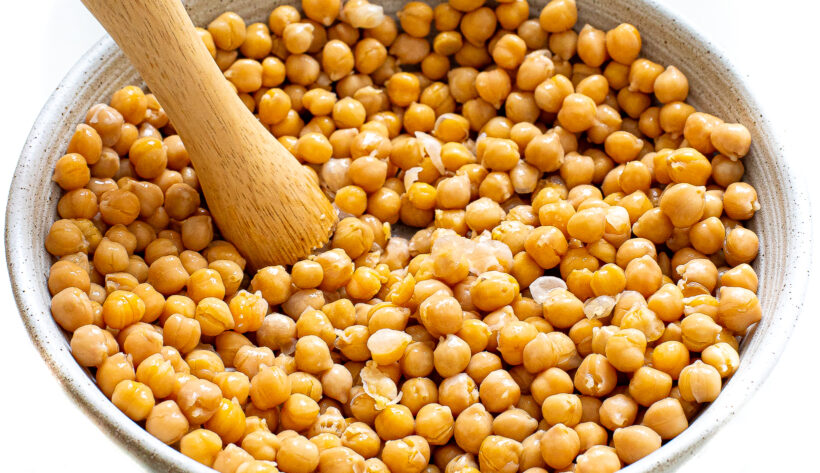 Chickpeas mashed with a wooden spoon.