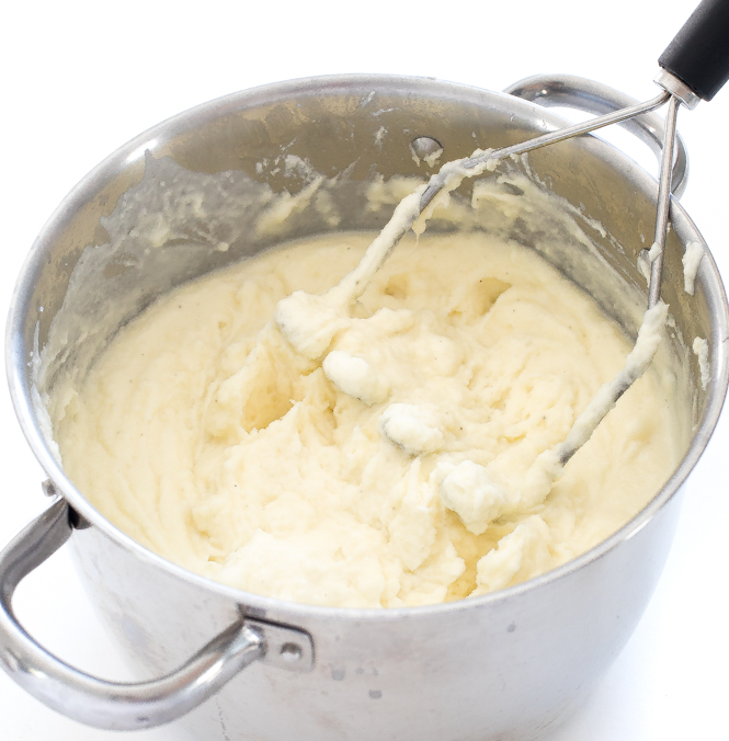 stirring in more milk to mashed potatoes