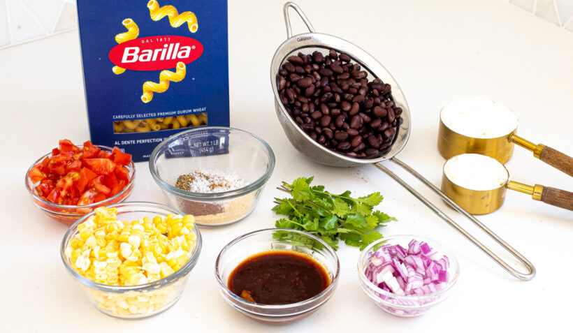 Ingredients laid out for mexican pasta salad.