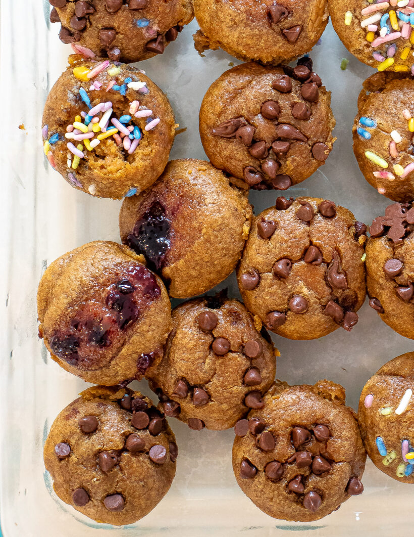 overhead shot of mini flourless muffins in clear glass Tupperware