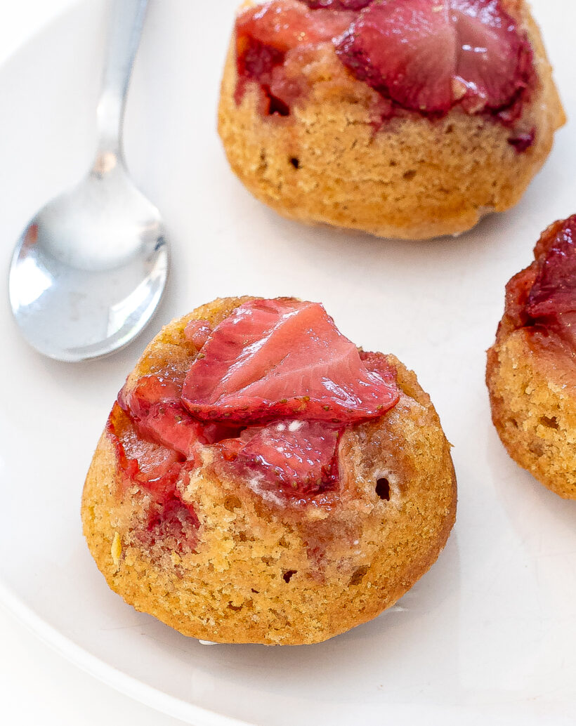 Mini Upside down strawberry cake on a white plate. 