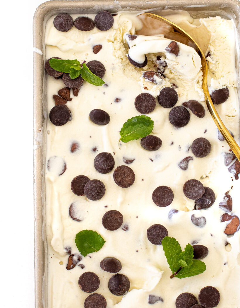 Fresh mint chocolate chip ice cream in a loaf pan after being frozen. 