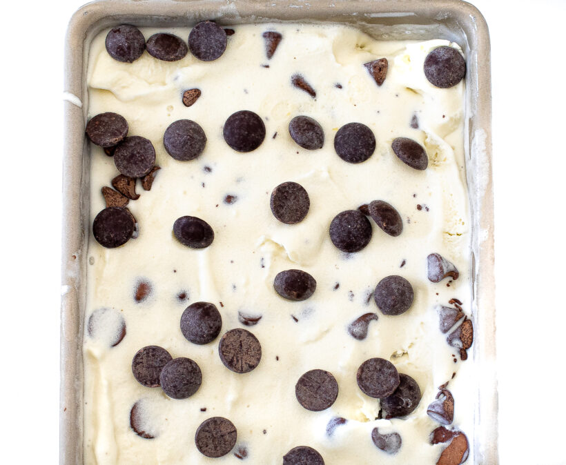 Frozen mint chocolate chip ice cream in a loaf pan. 