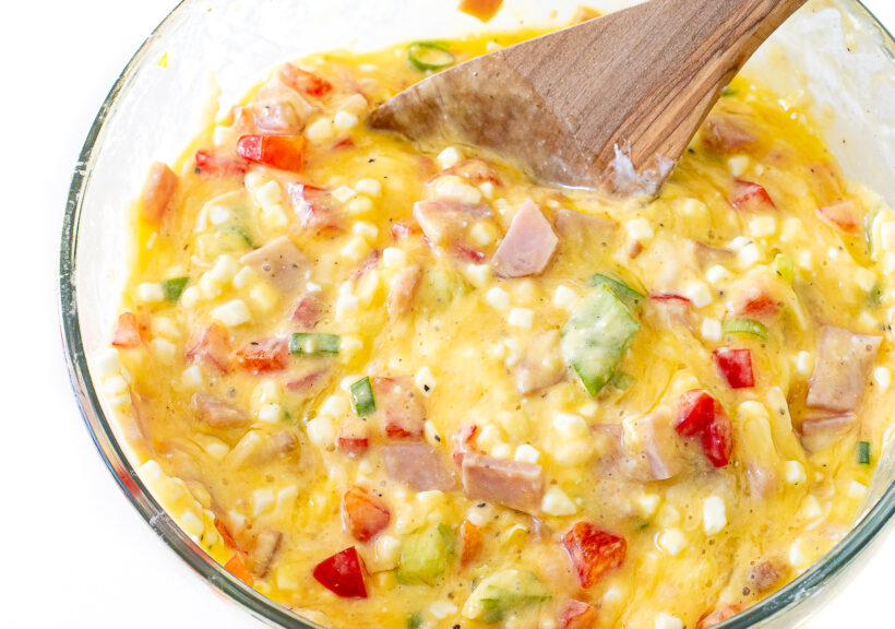 Egg cups ingredients in a mixing bowl.